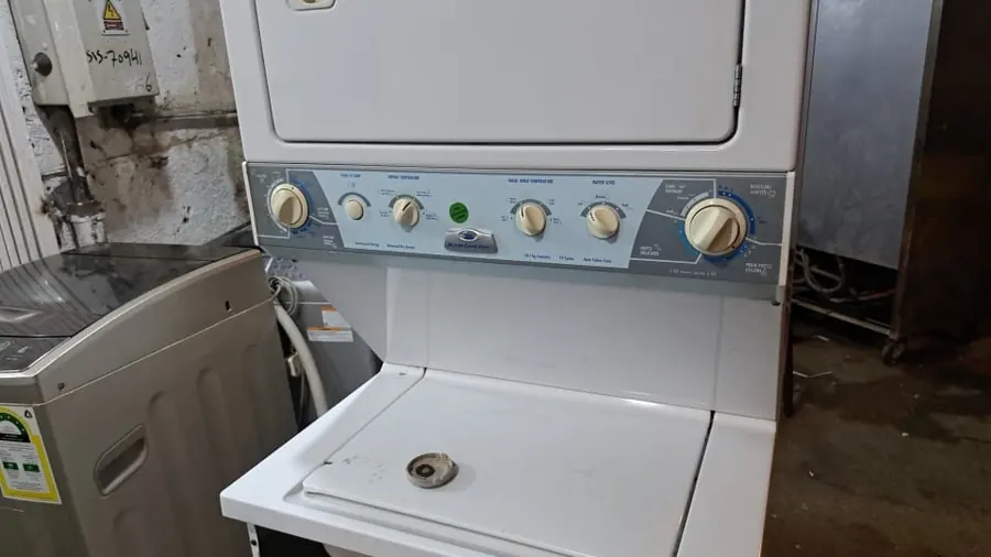 Stacked washer & dryer unit in our workshop — repair by Noura, Riyadh